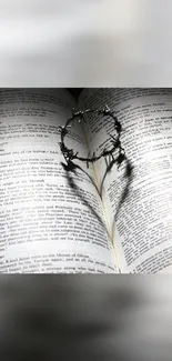 Heart-shaped shadow on an open book page with a barbed circle on top.