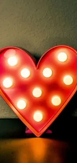 Heart-shaped LED lights mobile wallpaper with a warm glowing effect.