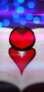 Heart shape on book with blue bokeh background.