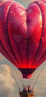 Heart-shaped hot air balloon in the sky.