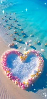 Heart-shaped seashell art on a serene beach with vibrant blue water.