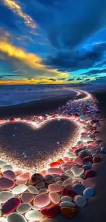 Heart-shaped beach design with colorful pebbles at sunset.