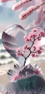 Heart-shaped crystal with cherry blossoms on a beach.