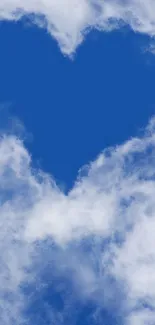 Heart-shaped cloud in a vibrant blue sky.