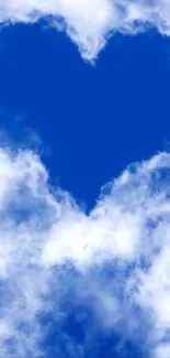 Heart-shaped cloud in vibrant blue sky, perfect for a romantic wallpaper.