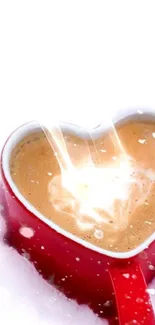 Heart-shaped coffee in a red cup with a splash of milk.