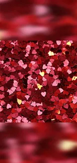 Colorful heart-shaped confetti scattered on a vibrant red background.