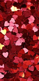 Red heart-shaped confetti creating a vibrant and romantic pattern.