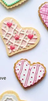 Heart-shaped cookies with pink icing on a white background.