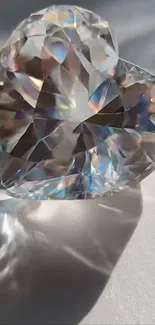 Heart-shaped crystal reflecting colorful light elegantly.