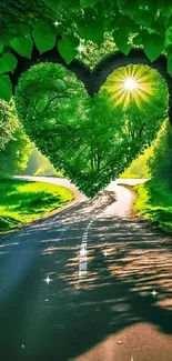 Heart-shaped tree canopy over a forest road with sunlight glowing through leaves.