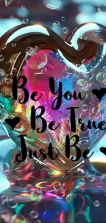 Colorful heart-shaped glass art with motivational quote.