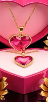 Heart-shaped jewelry in a pink gift box with flowers.