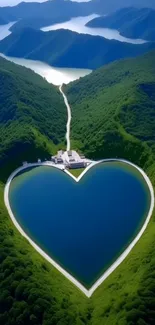 Heart-shaped lake surrounded by lush green hills under a clear sky.