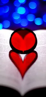 Heart-shaped shadow with red light on book pages and bokeh background.