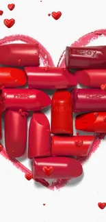 Lipstick pieces form a heart on a white background.