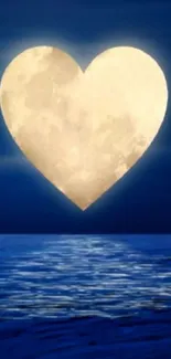 Heart-shaped moon over a calm ocean at night.