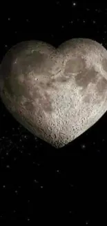 Heart-shaped moon set against a starry black background.