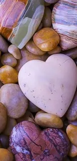 Heart-shaped pebbles in earthy tones create a calming mobile background.