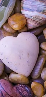 Heart-shaped stones on pebbles background.