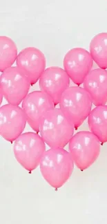 Heart-shaped pink balloons on a white background, creating a lovely design.