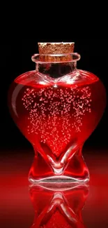 Heart-shaped bottle with red liquid on black background.