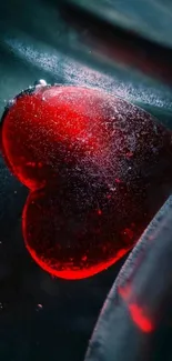 Red heart-shaped ice on a dark background.