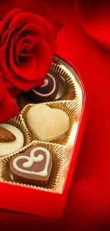 Heart-shaped chocolates with roses on a red silk background.