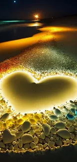 Heart-shaped sand design on beach at night under moonlight.