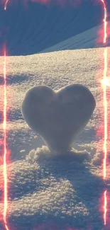 Heart-shaped snow sculpture with fiery glow on a winter landscape.