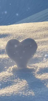 Heart-shaped snow shadow in winter light.