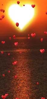 Heart-shaped sunset over sea with orange glow.