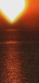 Heart-shaped sunset over ocean, calming view.