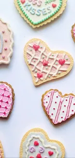 Heart-shaped cookies with pink and white icing on a light background.