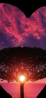 Heart-shaped silhouette of a tree at sunset.