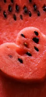 Heart-shaped watermelon slice on a red background.