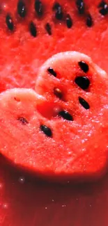 Heart-shaped watermelon with seeds in vibrant red.