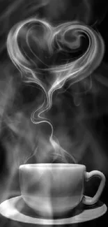 Heart-shaped smoke rising from coffee cup against black background wallpaper.