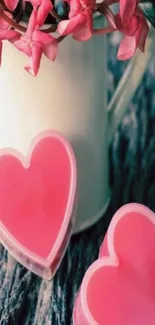 Heart-shaped pink soap with pink flowers and rustic texture.