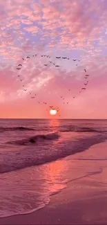 Heart-shaped bird formation at sunset on a serene beach