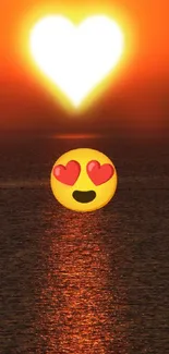 Heart-shaped sunset with emoji over ocean.