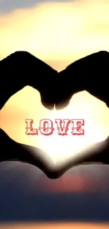 Heart silhouette at sunset with love text.