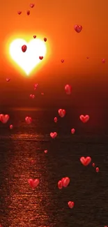 Heart-shaped sun setting over ocean in a warm, vibrant sunset.