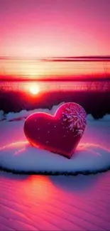 Heart on snow with vibrant sunset.