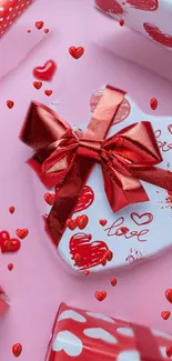 Heart-shaped gift wrapped in red ribbon on pink background.