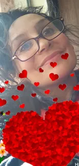 Woman with glasses and red hearts on mobile wallpaper.