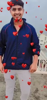 Smiling person with red hearts on rooftop wallpaper.