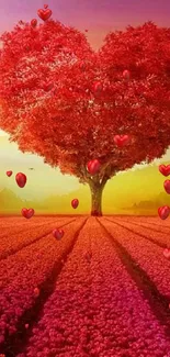 Heart-shaped tree under a vibrant sunset in a field of red flowers.