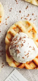 Heart-shaped waffles with ice cream topped with sprinkles on a light background.