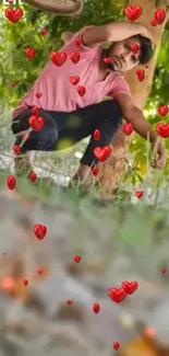 Person sitting under tree with falling red hearts.